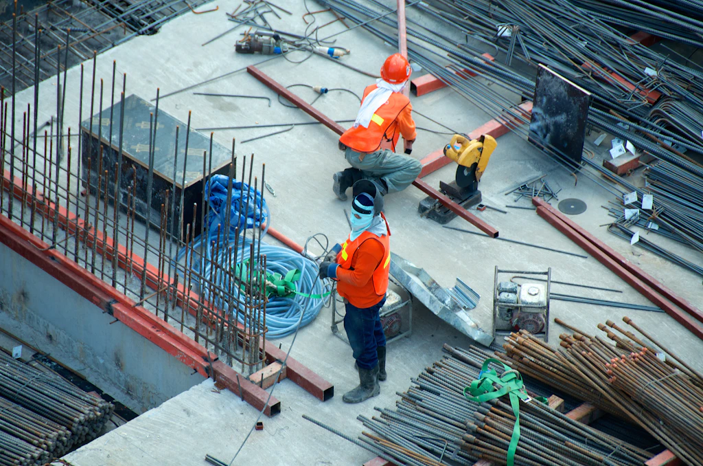 Overhead view of trades tying steel reinforcement before a pour