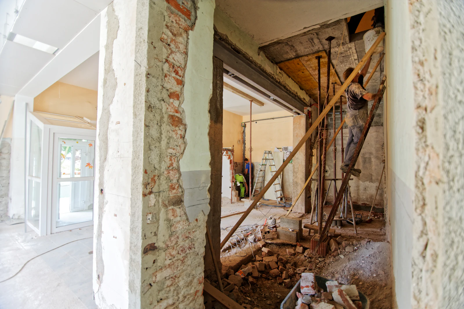 Renovation strip-out with exposed timber framing and original masonry